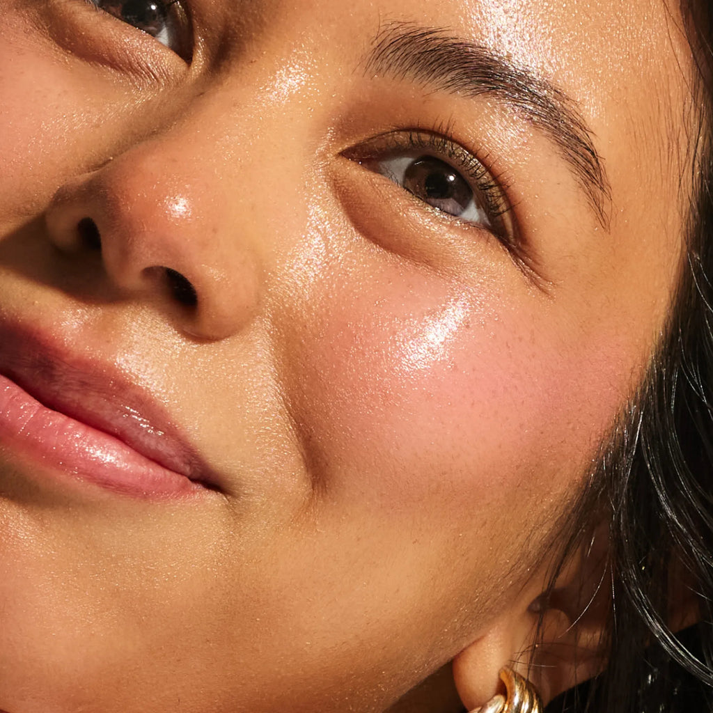 Close-up of medium skin tone showing a soft natural pink flush across the cheek from the Annadea Power Walk Blush Serum in Soft Step, highlighting the serum's buildable rosy colour and luminous dewy finish