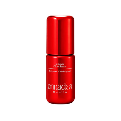Annadea To Dew Glow Serum in a red metallic bottle showing the To Dew Glow Serum label with brighten and strengthen claims, 30ml on a white background