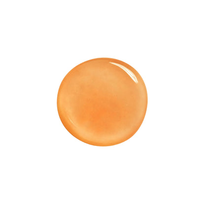 Close-up swatch of Annadea To Dew Glow Serum showing its translucent amber gel texture, a velvety hydrating serum formula that blends seamlessly into skin