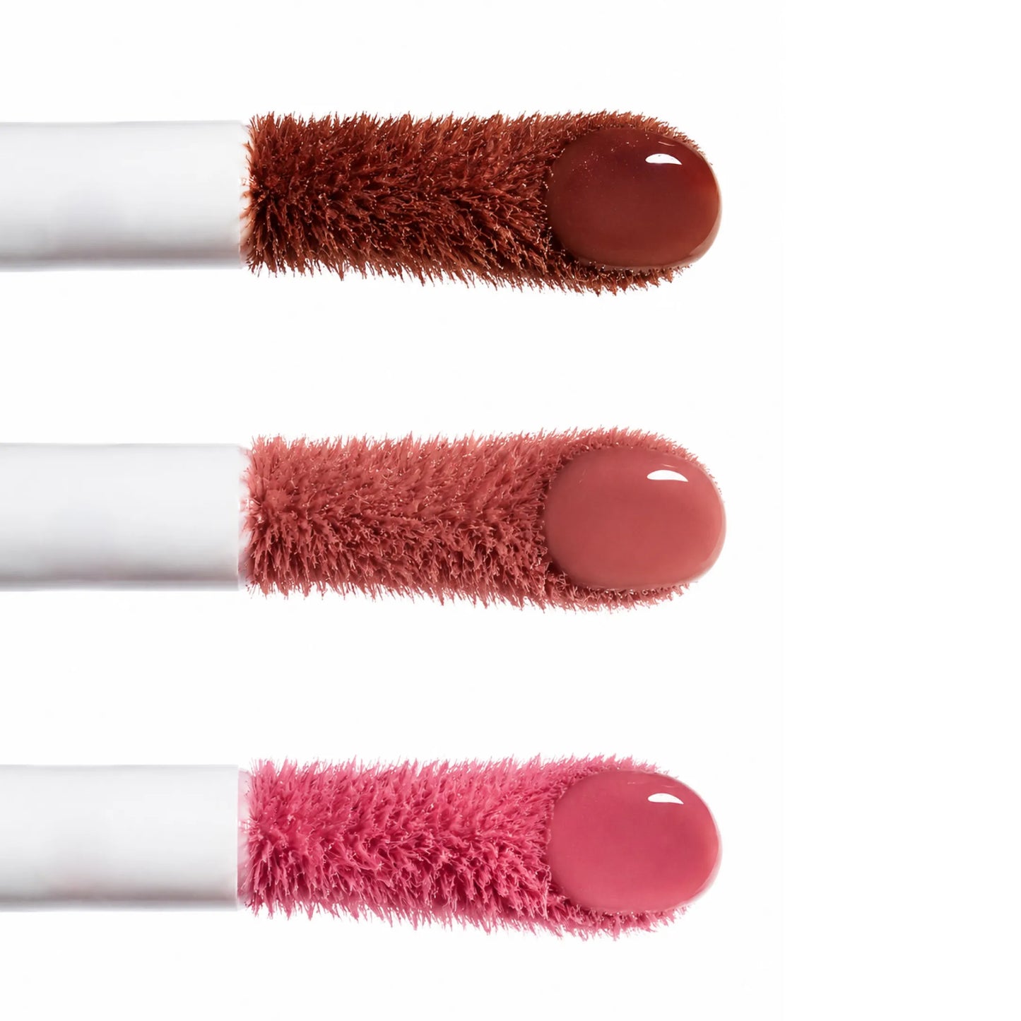 Close-up of three Annadea Power Walk Blush Serum applicator wands showing Late Date, Rose Trail, and Soft Step shades from top to bottom, displaying the serum texture and pigment of each blush shade
