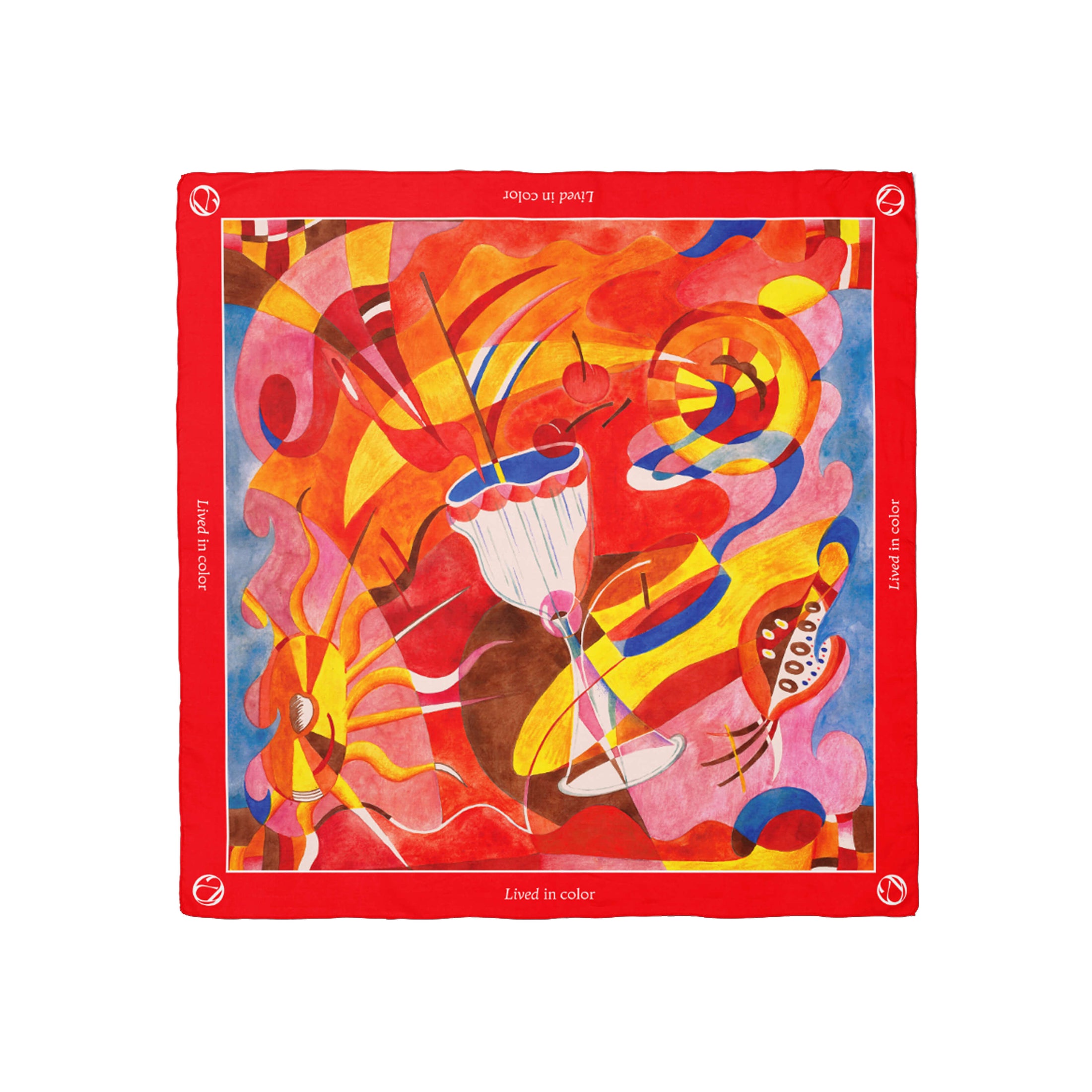 Annadea Lived in Color limited-edition silk scarf flat lay showing vibrant abstract artwork by Henriette Arcelin in red, yellow, pink, and blue with red border