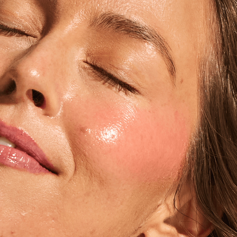 Close-up of light skin tone showing plump, bouncy cheek with rosy flush from Annadea Power Walk Blush Serum hyaluronic acid formula in Rose Trail